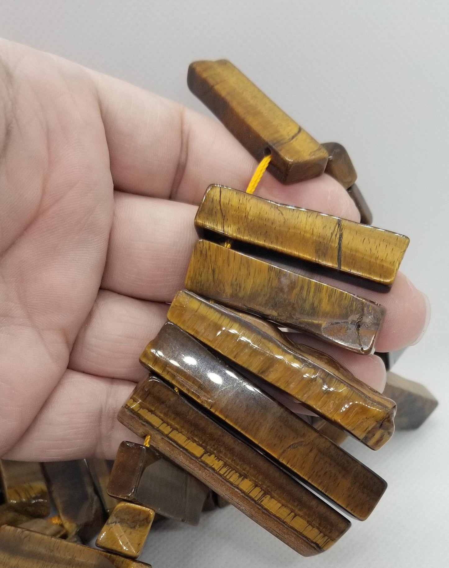 4 pieces Natural Tiger's Eye Points, Top Drilled, Rough Cut and Polished, Rectangle, 20~65x7~15x6~10mm, Hole 2mm