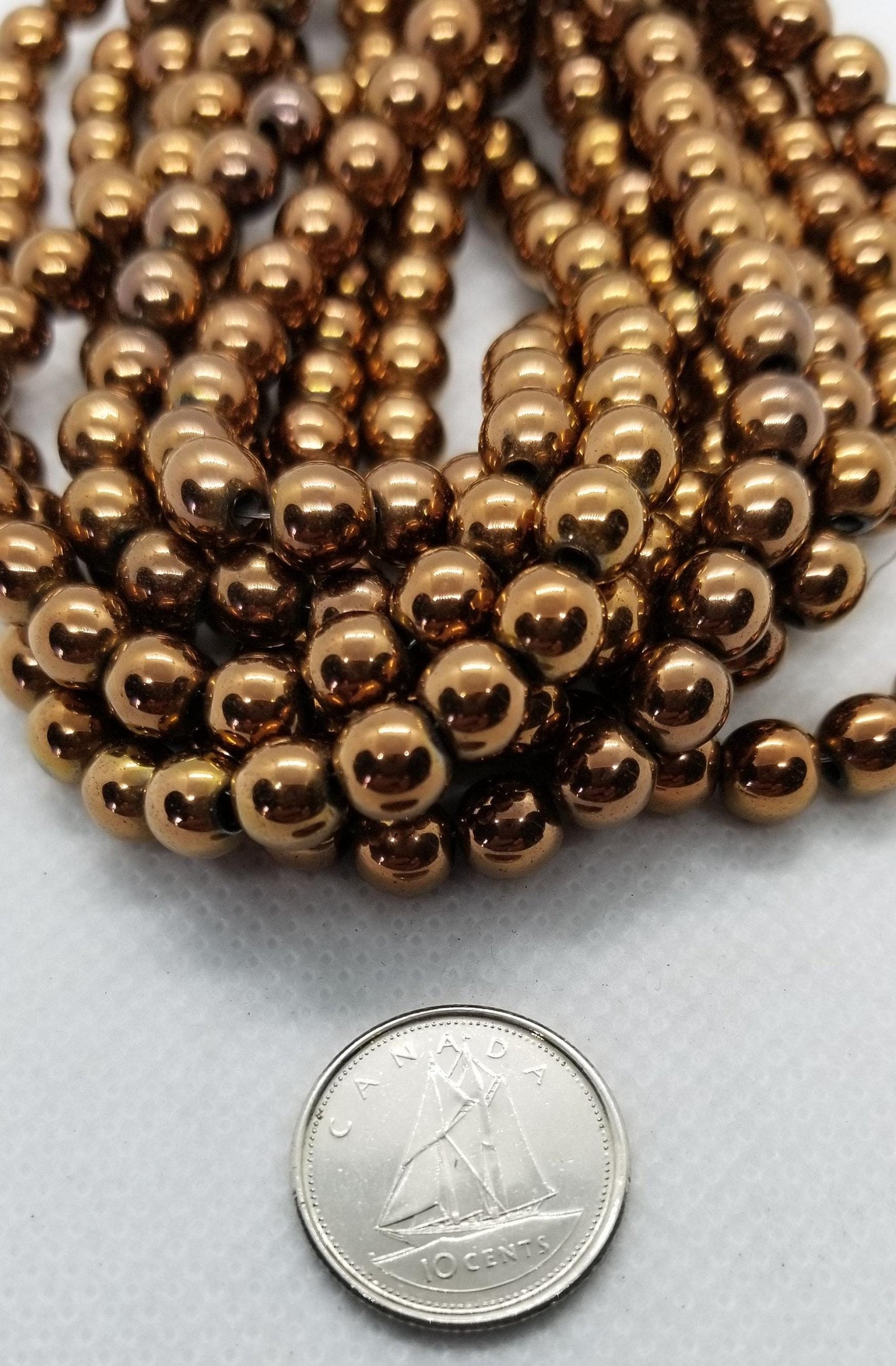 1 strand Round Copper Hematite Beads, Grade A, Non-magnetic Synthetic, Copper colour Plated, 6-8mm Hole 1mm, Full Strand, bead count in desc