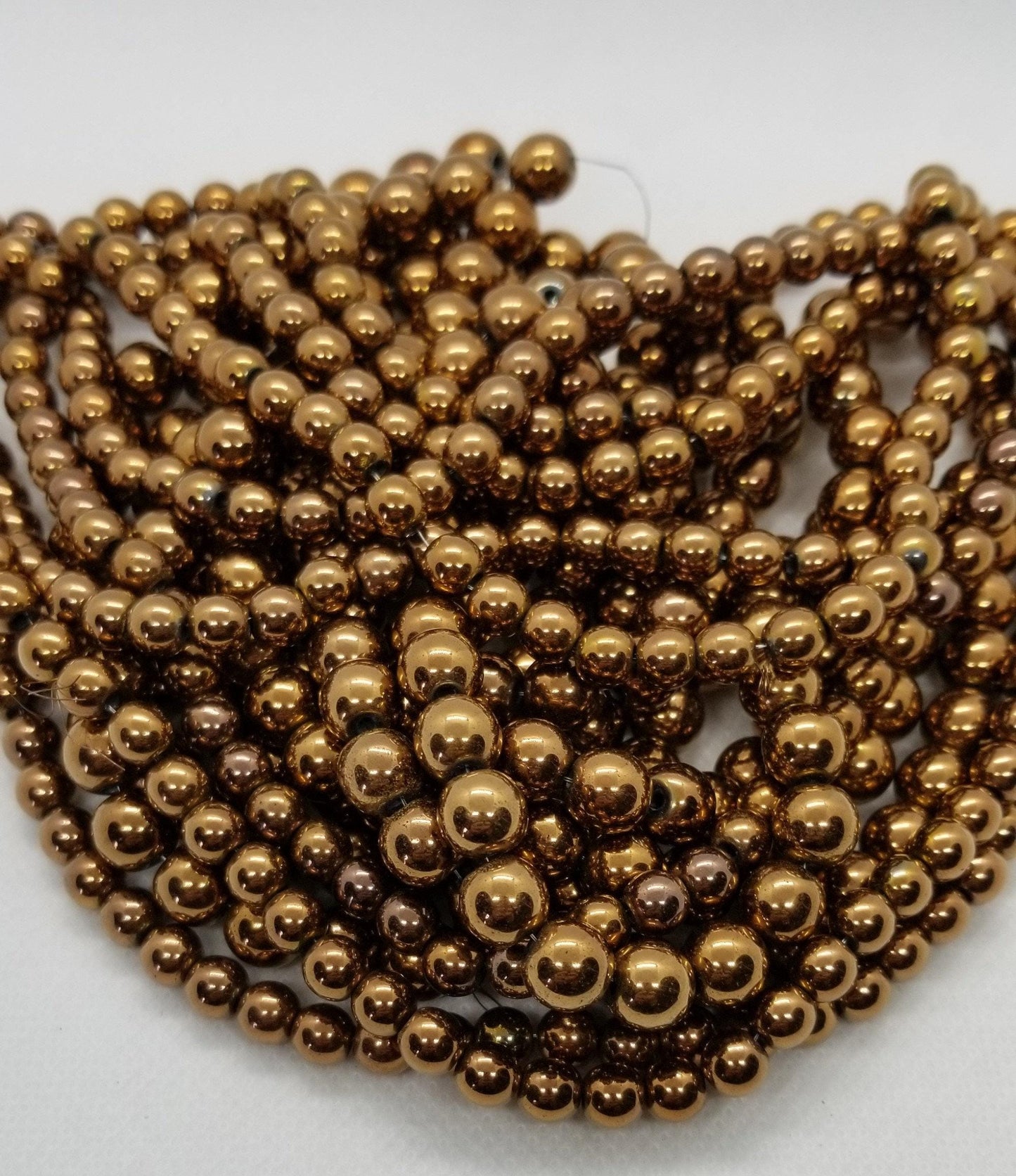 1 strand Round Copper Hematite Beads, Grade A, Non-magnetic Synthetic, Copper colour Plated, 6-8mm Hole 1mm, Full Strand, bead count in desc