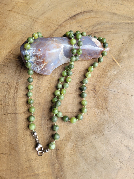 Green Jade Necklace on a wooden surface