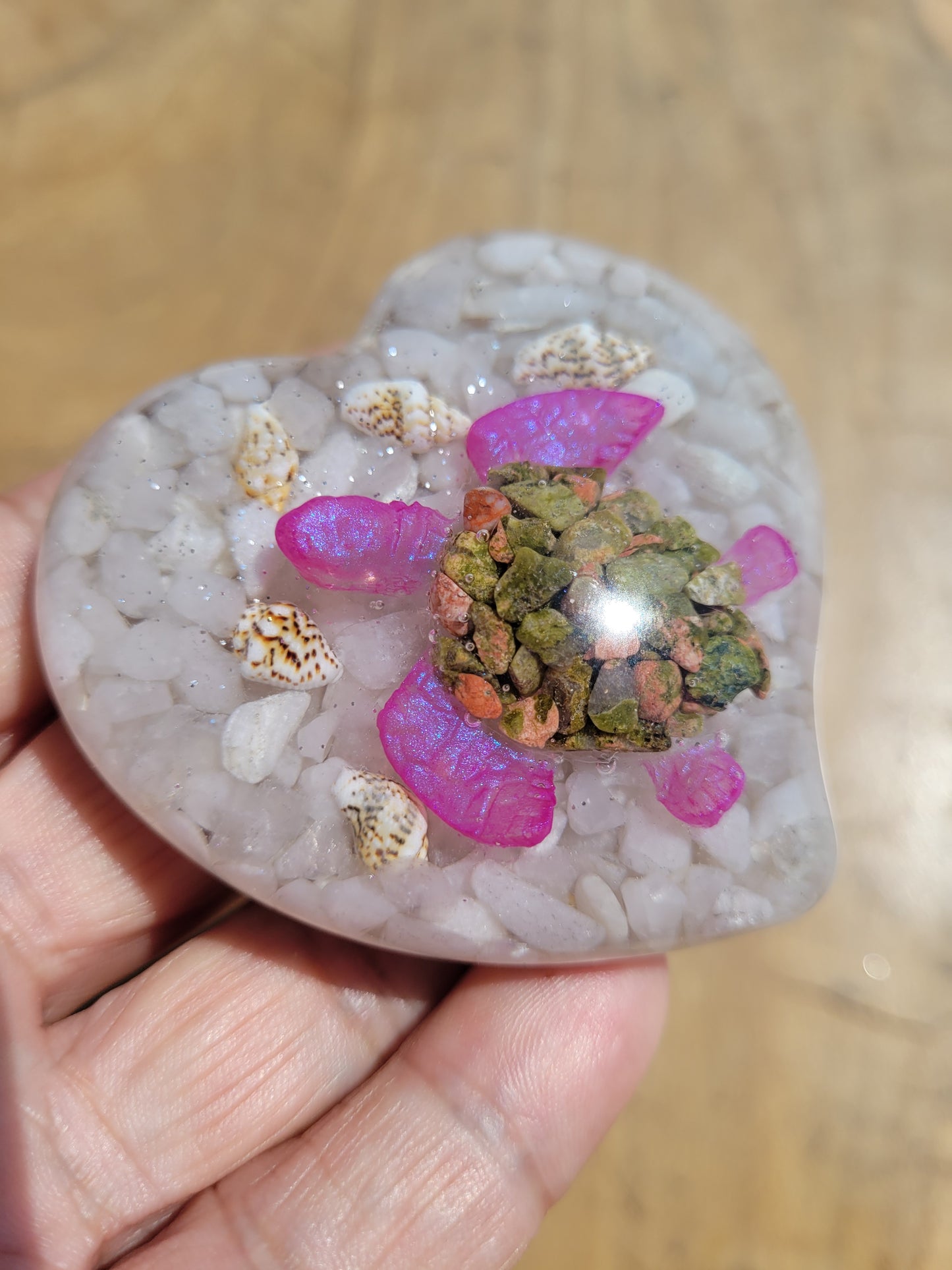 Crystal and resin heart with crystal turtle inside.