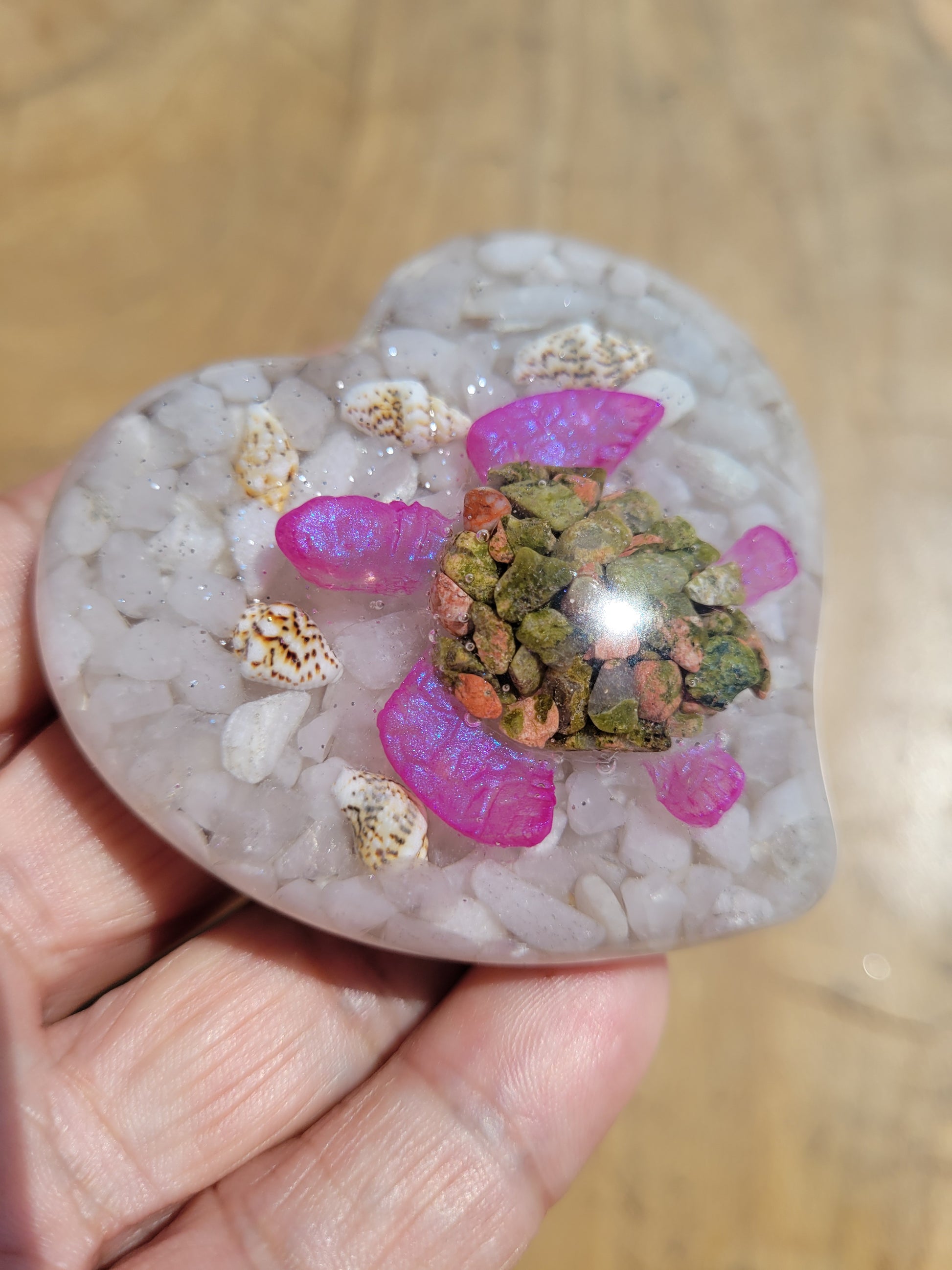 Crystal and resin heart with crystal turtle inside.