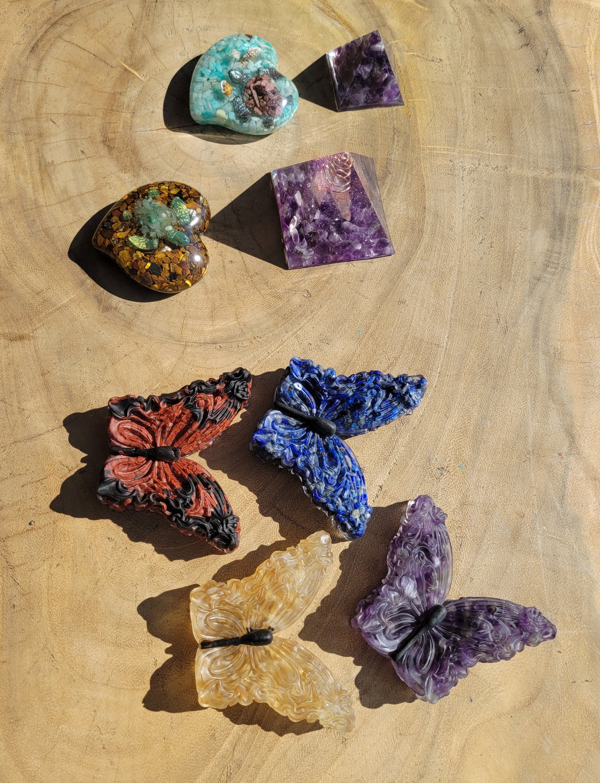 Butterflies and crystals on a wooden surface