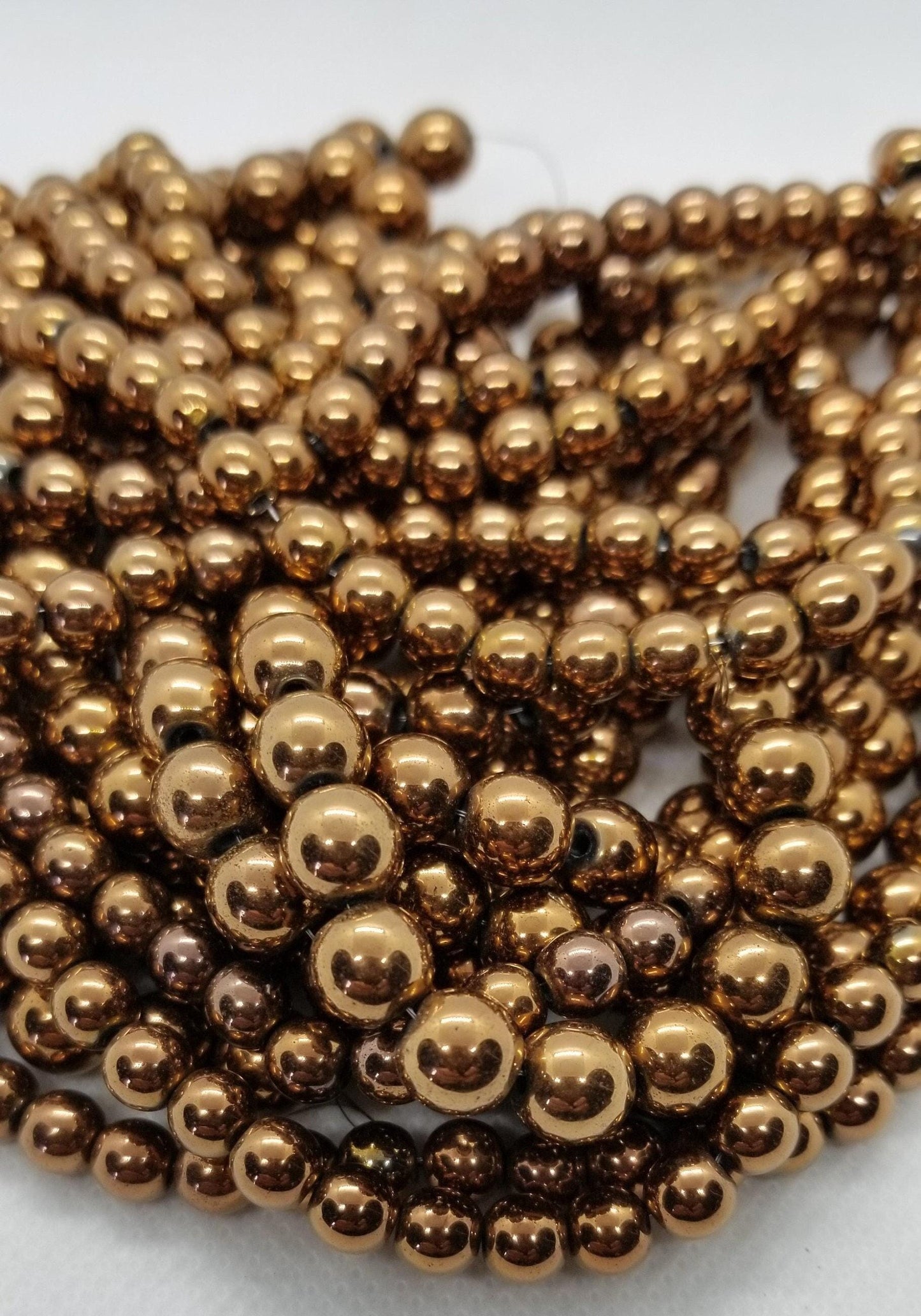 1 strand Round Copper Hematite Beads, Grade A, Non-magnetic Synthetic, Copper colour Plated, 6-8mm Hole 1mm, Full Strand, bead count in desc