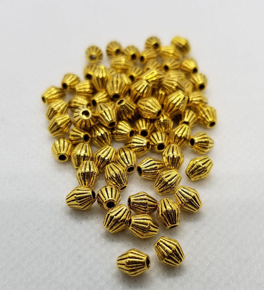 10 pieces Golden Bicone, Striated, Corrugated, Tibetan Style Alloy, Lead, Cadmium Free, Antique Golden, 5x6mm, hole 1mm
